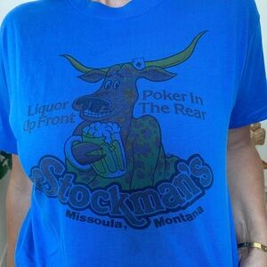 Blue short sleeve cheeky tee. Liquor up front, Poker in the rear